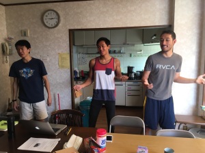 Brandon, Matt and Scott teaching the rest of the team the hand motions to our theme song!